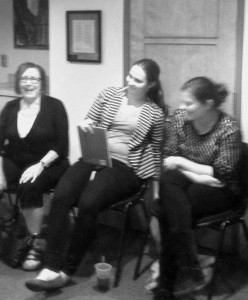 Laura (center) laughing with other members.